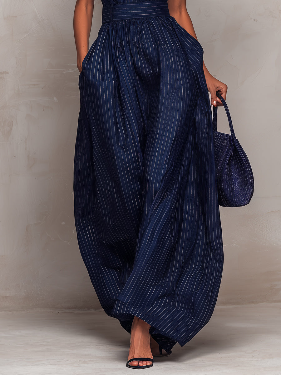 Anna - Donkerblauwe gestreepte jumpsuit met sleutelgatscut en wijde broek